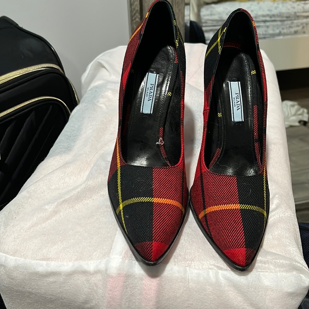Prada beautiful but slightly torn on bottom heel. Worn once